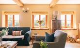 A beautiful sitting room with plenty of comfortable seating, natural light and original features - Thumbnail Image