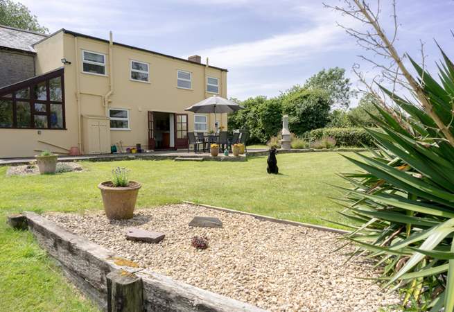 The cottage boasts a large private garden with spacious raised patio and plenty of outdoor seating