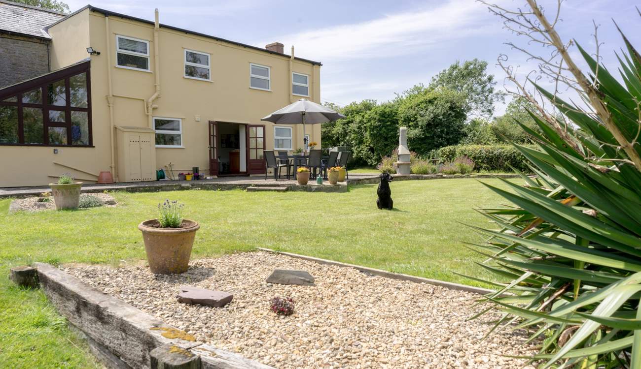 The cottage boasts a large private garden with spacious raised patio and plenty of outdoor seating