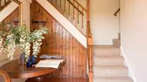The quirky and characterful split stairwell leads you up...