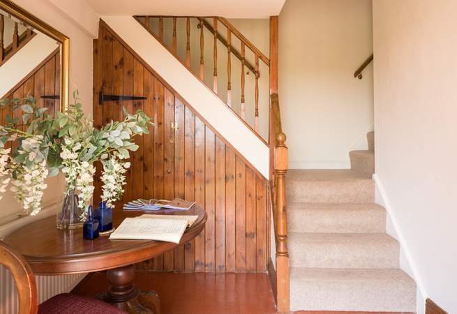 Quirky and characterful split stairwell leads you up...