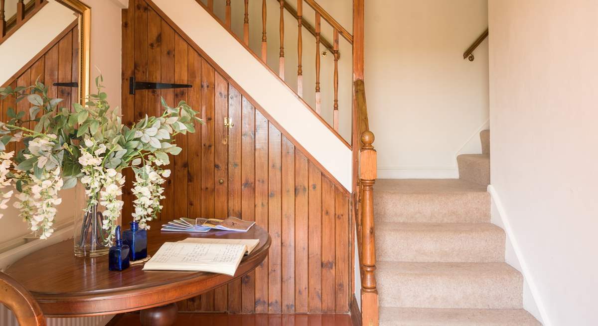 Quirky and characterful split stairwell leads you up...