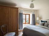 Every bedroom has uninterrupted countryside views, this double bedroom faces over the front of the cottage.