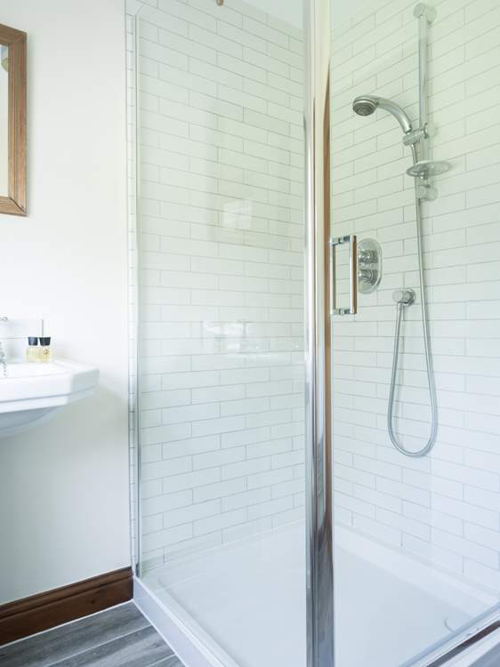 Bright upstairs shower room is additional to the main bathroom