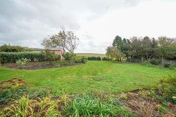The enclosed garden overlooks views of the countryside.