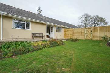 There is a raised terrace to the rear of the cottage which steps down to the well kept garden.