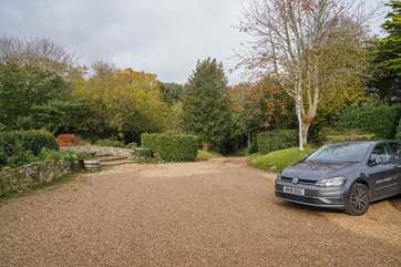 There is private parking for two cars in front of the main house.