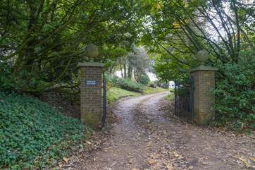 The grand driveway from the main road leads to The Clock House.
