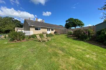 There is a raised terrace to the rear of the cottage which steps down to the well kept garden.