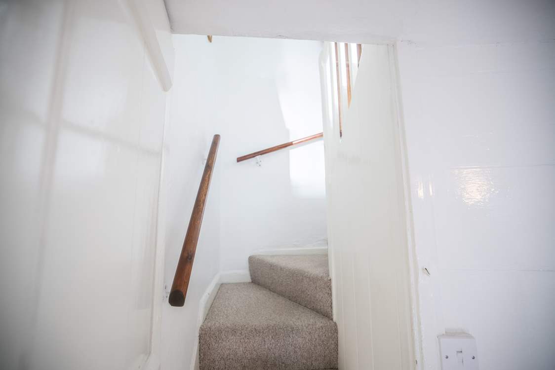 Please mind your head as you ascend and descend the stairs which are steep but benefit from a handrail.