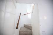 Please mind your head as you ascend and descend the stairs which are steep but benefit from a handrail.