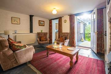 You will find the utility-area and WC by walking through the kitchen.