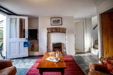 All rooms lead off of the sitting-room as well as the stairs up to the two bedrooms.