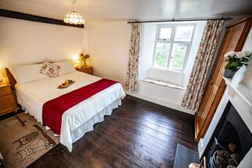 The main bedroom benefits from an original fire (now ornamental) and has views over the platform at the back of the house.