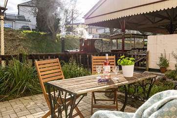 Enjoy a drink on your private patio area next to the railway.