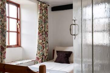 The twin is comfortable and warm for an original cottage.
