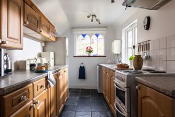 The kitchen floods with light and has wonderful views of the platform. At the end of the kitchen you will find a small utility area and the downstairs WC.