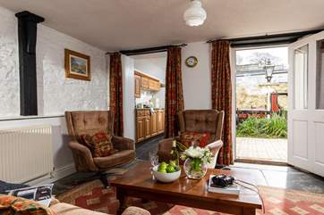The sitting-room is the heart of the cottage and enjoys a view out across your private patio to the platform.