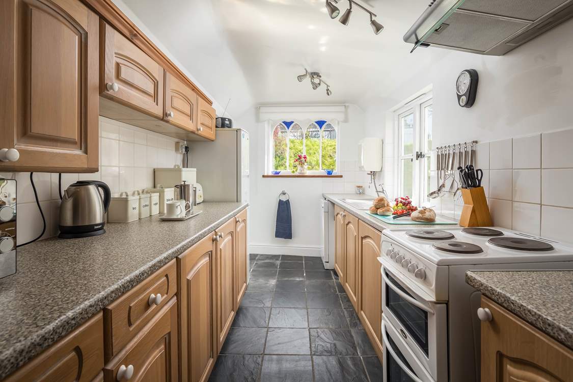 The kitchen floods with light and has wonderful views of the platform. At the end of the kitchen you will find a small utility area and the downstairs WC.