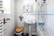 The bathroom is on the ground floor and benefits from a bath and an electric shower.