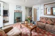 All rooms lead off of the sitting-room including the stairs to the bedrooms. The sitting-room is comfortable and cosy for those colder months.