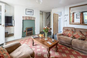 All rooms lead off of the sitting-room including the stairs to the bedrooms. The sitting-room is comfortable and cosy for those colder months.