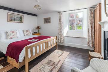 The main bedroom is a comfortable size overlooking the platform at the back of the house.