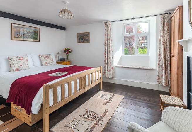 The main bedroom is a comfortable size overlooking the platform at the back of the house.
