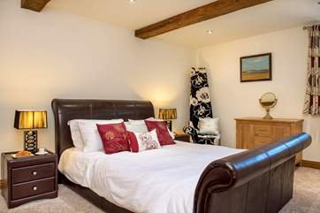 Bedroom 1 is located on the ground floor and has a super-comfy double sleigh bed.