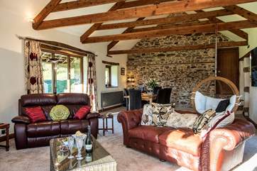 The sitting/dining-room is a wonderfully spacious room.
