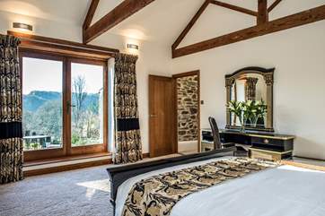 The French windows allow you to step out onto the terrace and down to the hot tub - so you can take a sneaky dip.