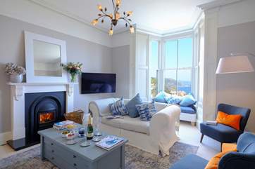 The beautiful sitting-room where you can enjoy harbour views at any time of year. Please note the fire is ornamental only.
