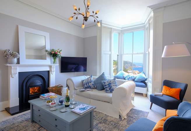 The beautiful sitting-room where you can enjoy harbour views at any time of year. Please note the fire is ornamental only.