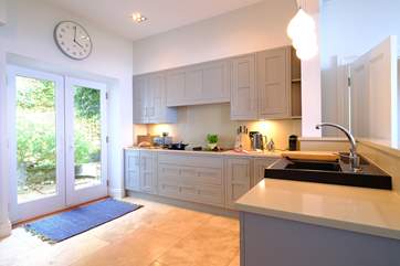 The fabulous kitchen and through the French doors is the secluded patio.