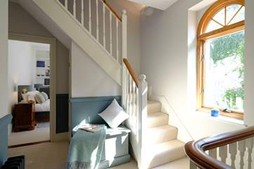 Stairs lead up to the second floor and bedrooms 4 and 5.