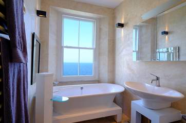 The family bathroom on the first floor offers a bath with a view!