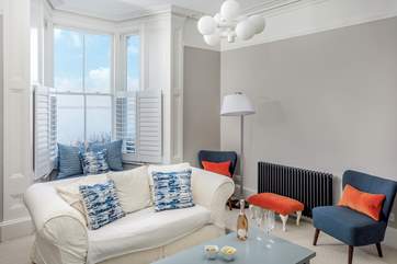 The beautiful sitting-room where you can enjoy harbour views at any time of year. Please note the fire is ornamental only.
