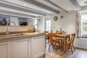 The dining table easily accommodates four people.