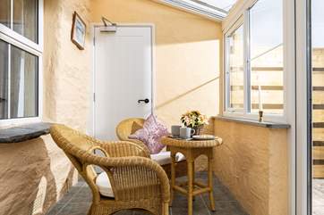 The sunny conservatory is a lovely spot for a morning coffee and of course cake. The solid fire door through to the neighbouring property is always securely locked and bolted on both sides.
