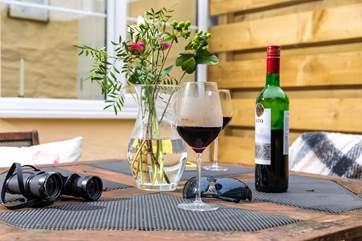 The sunny patio is a perfect spot for a pre-dinner glass of wine.