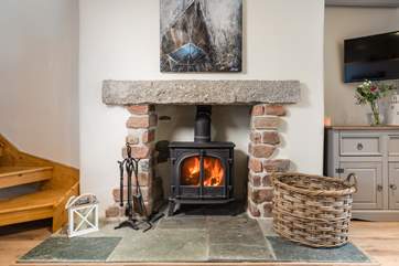 The toasty wood burner will keep everyone warm on the chillier nights.