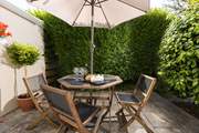 The sunny patio is a lovely spot for a pre dinner drink.