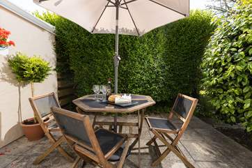 The sunny patio is a lovely spot for a pre dinner drink.