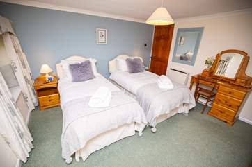 This delightful twin is on the first floor and has views over the garden and rolling hills.