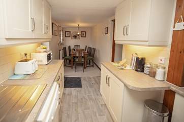 The kitchen/dining-room offers the perfect setting to start and finish a day.