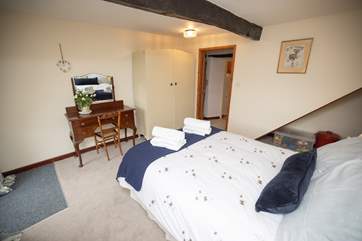 The downstairs bedroom is close to the kichen and downstairs bathroom.