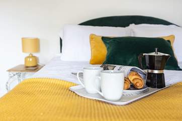 The king-size bed is the perfect place to recharge at the end of the day.