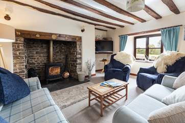 The sitting-room sits to the back of the house, with views and a back door out to the garden. The crowning glory has to be the wonderful log-burner that will keep everyone toasty.