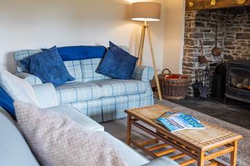 The sitting-room sits to the back of the house, with views and a back door out to the garden. The crowning glory has to be the wonderful wood-burner that will keep everyone toasty.