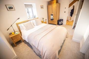 The double en suite bedroom benefits from dual-aspect windows which allow the room to flood with light.